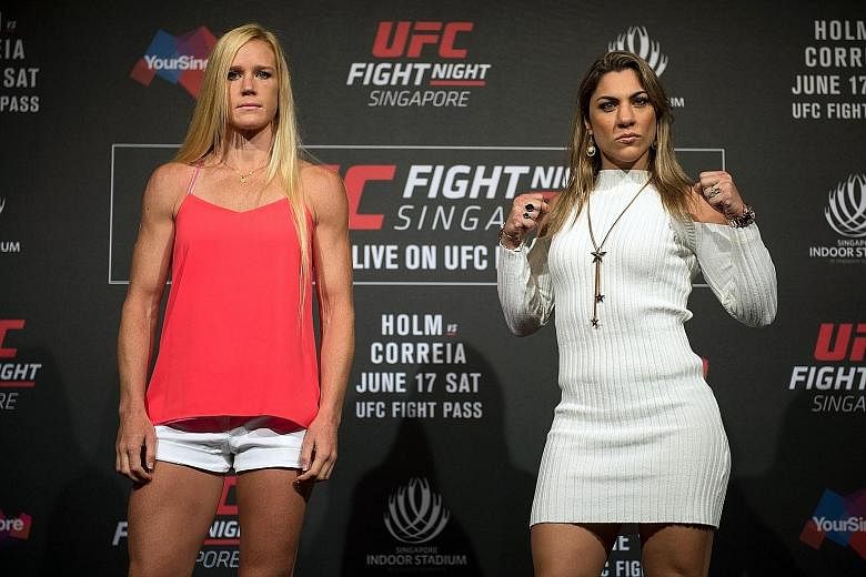 MMA fighters Holly Holm (left) and Bethe Correia face off before their main event in UFC Fight Night Singapore.