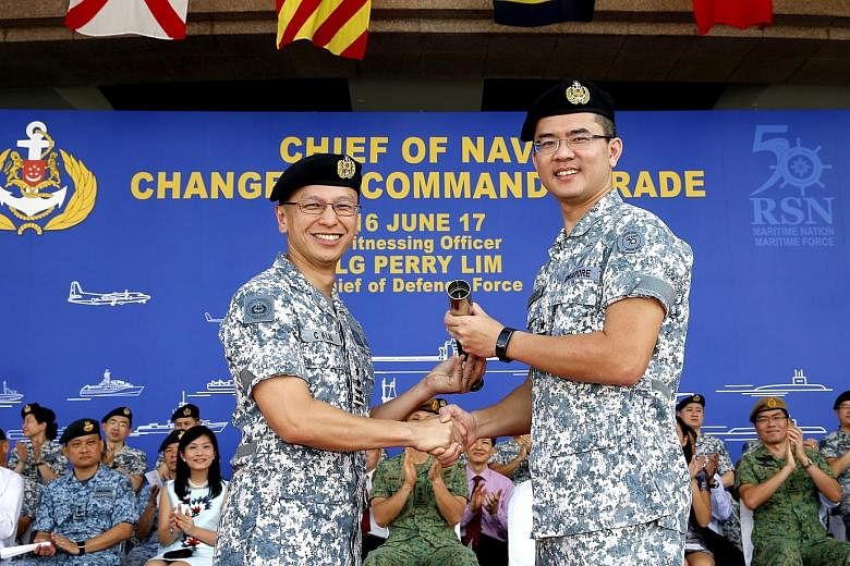 The command of the Republic of Singapore Navy (RSN) was handed over to Rear-Admiral (RADM) Lew Chuen Hong (right), by outgoing navy chief Lai Chung Han at RSS Singapura - Changi Naval Base yesterday morning. RADM Lew, 41, joined the Singapore Armed F