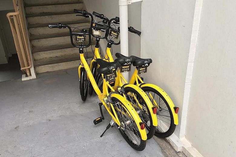 An oBike bicycle parked outside an Yishun flat in a manner that obstructs the common corridor, posing a safety hazard. Bicycles from bike-share firms which have been impounded by the Land Transport Authority. The two-wheelers, which are unlocked usin