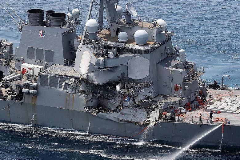 The damaged bow of ACX Crystal, the Philippine-flagged cargo ship. There were no casualties among the 20 Philippine crew. The USS Fitzgerald as seen off the Shimoda coast yesterday. The sailors were thought to have been thrown into the sea, or trappe