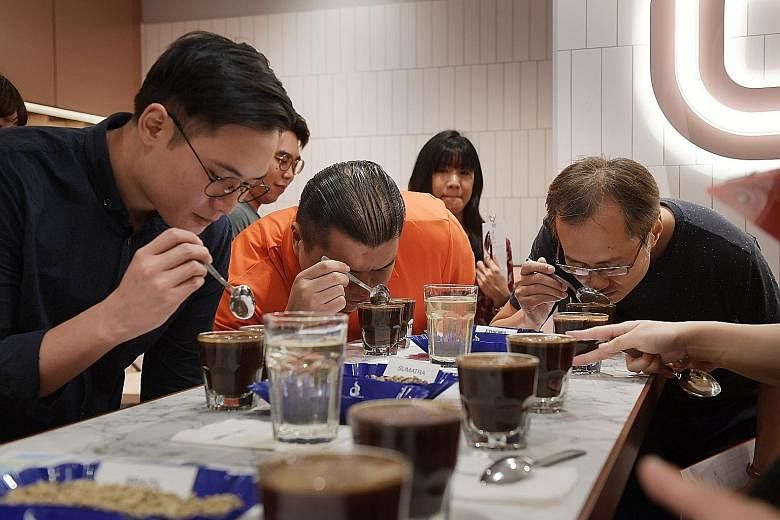 At Jewel Coffee, participants make tasting notes as they smell and sip different types of coffee. They also got to try cupping, a coffee-tasting technique, to evaluate the aroma and flavours of different beans.