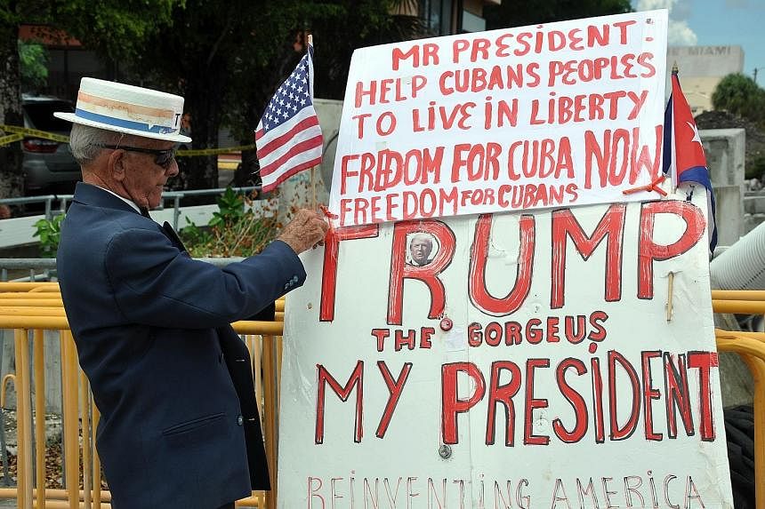 A sign in Miami, Florida, referencing US President Donald Trump's rollback of his predecessor Barack Obama's deal re-opening trade ties with Havana. The deal had its fair share of supporters and critics.