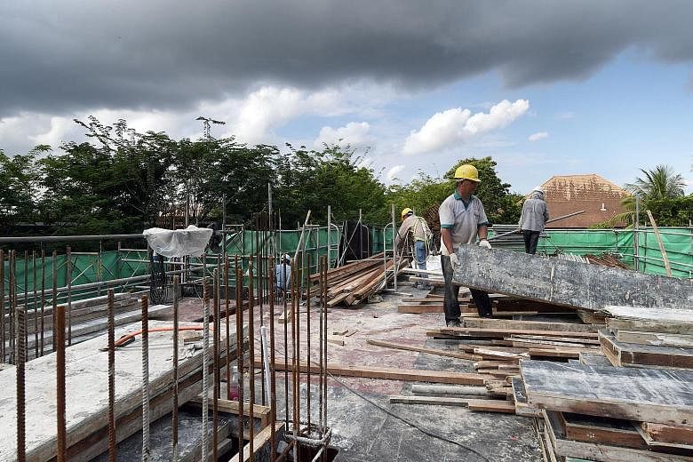 Traditional building methods being employed at a construction site. The BCA is pushing for new methods to be used which would reduce reliance on workers, such as prefabricated prefinished volumetric construction.