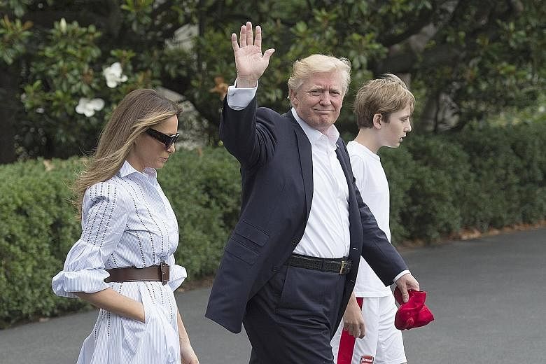 United States President Donald Trump walking to Marine One with First Lady Melania and their son, Barron, as they departed the White House for Camp David last Saturday. Nearly five months into his presidency, it is Mr Trump's inaugural visit to what 