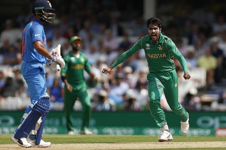 Pakistan fast bowler Mohammad Amir (right) ripped through the Indian top order at The Oval in London yesterday, claiming three wickets, including that of skipper Virat Kohli.