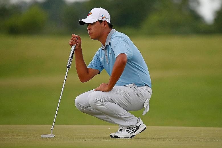 Kim Si Woo lining up a putt during the US Open third round. The South Korean had six birdies and two bogeys on Saturday.