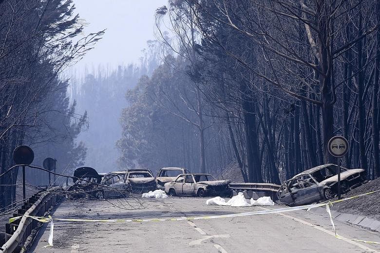 Portugal has declared three days of national mourning following a fire that started about 200km north-east of Lisbon before spreading fast across several fronts. More than 20 villages have been affected. Burnt cars and body bags on a road near the Pe