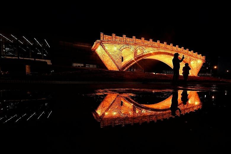 A "Golden Bridge on Silk Road" installation set up outside the National Convention Centre in Beijing for the Belt and Road Forum on International Cooperation held last month. During the summit, Chinese President Xi Jinping pledged an additional US$12