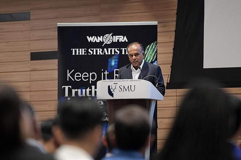 Law and Home Affairs Minister K. Shanmugam delivering the opening address yesterday at the conference on fake news.