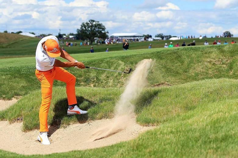 World No. 8 Rickie Fowler playing his shot from a bunker on the fifth hole during the final round of the US Open at Erin Hills. Fowler once again fell short at a Major.