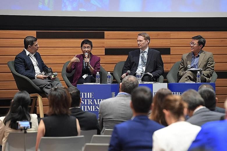 (From left) ST editor and panel moderator Warren Fernandez with Rappler CEO Maria Ressa, Reuters managing editor Jason Subler and Singapore Management University law don Eugene Tan at the forum yesterday.