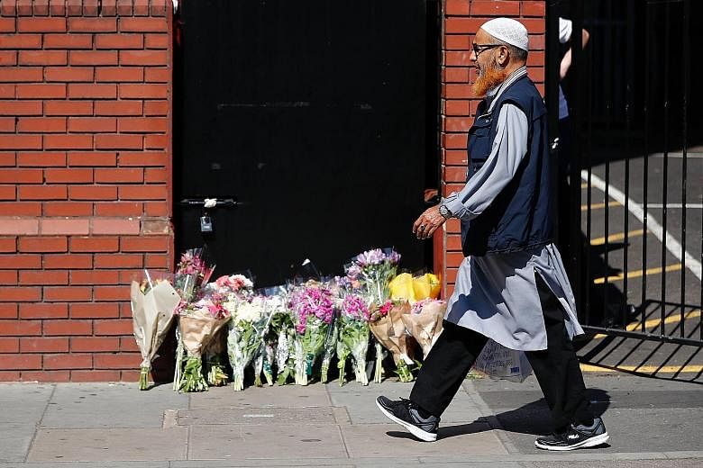 Above: Floral tributes outside Finsbury Park Mosque in north London yesterday. In the attack, which killed one person and injured 10 others, a van swerved into worshippers leaving after prayers at the mosque and the nearby Muslim Welfare House. Left: