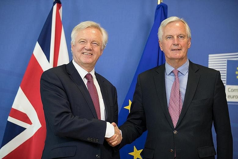British Brexit Minister David Davis (far left) and the EU's chief negotiator, Mr Michel Barnier, started the talks on a positive note.