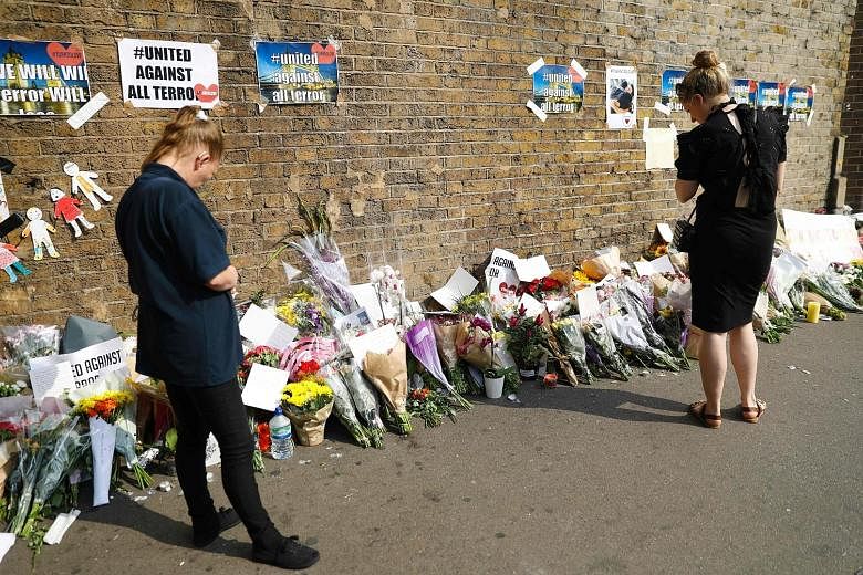 Many left flowers in the Finsbury Park area in London yesterday for the victims of Monday's attack on worshippers at a nearby mosque.