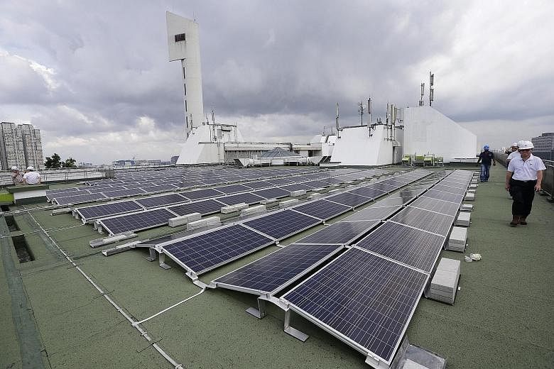 Solar panels on the rooftop of Jurong Town Hall. The agreement will enable Sun Electric to generate up to 5 megawatt-peak of electricity, which will be fully exported to Singapore's electricity grid. Power generated under existing solar leasing model