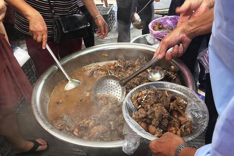 Dog meat being served at a restaurant in Yulin yesterday. The Chinese dog meat festival is notorious, with the animals beaten and boiled alive in the belief that the more terrified they are, the tastier the meat.