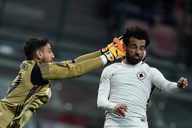 Roma midfielder Mohamed Salah vying for the ball with AC Milan goalkeeper Gianluigi Donnarumma. Salah had 15 goals and 11 assists in the past Italian Serie A season, and has caught the eye of Liverpool again.