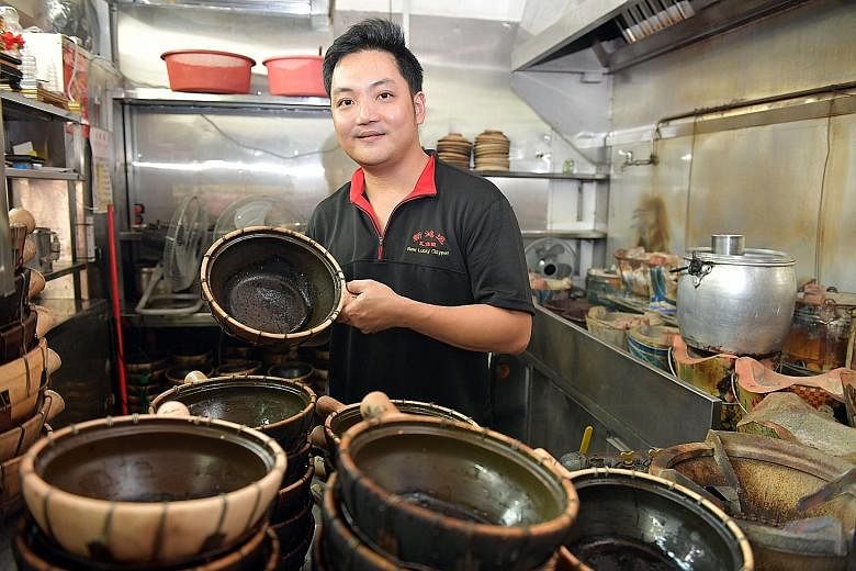 Secondgeneration owner Edmund Choong of New Lucky Claypot Rice in Holland Drive Market & Food Centre hopes being on the list means more people will try his dishes. Ah Er Soup owner Chen Hua Qiang and his wife Qu Fa Di. The stall's bestsellers are lot