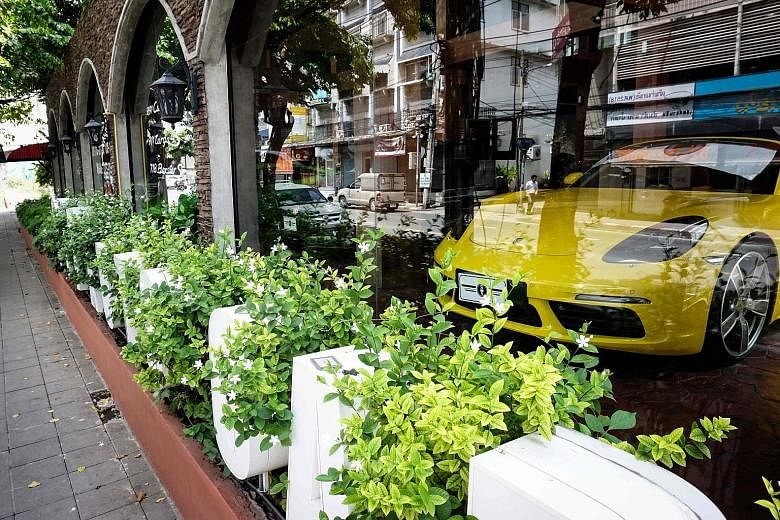 A sports car on display on June 14 in a Bangkok dealership accused of selling stolen cars. Thai investigators say dealers and corrupt Customs officials use scams and loopholes to circumvent high taxes.