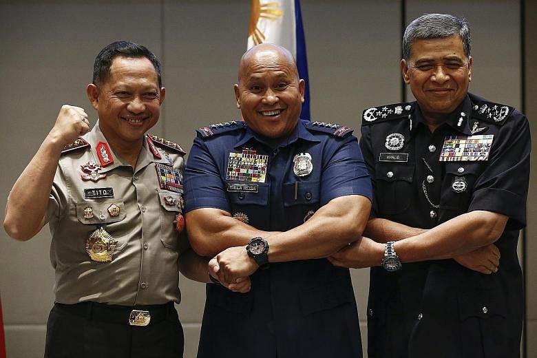 Indonesian Chief of National Police Tito Karnavian (fom left), Philippine National Police Director-General Ronald Dela Rosa and Malaysian Police Inspector-General Khalid Abu Bakar at the conference.