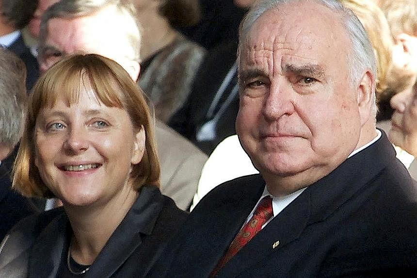 Above: Mr Helmut Kohl died on Friday at the age of 87. Left: Mr Walter Kohl, his son, and his niece were seen standing outside the late former German chancellor's home in Oggersheim, Ludwigshafen, on Wednesday after being turned away at the door in f