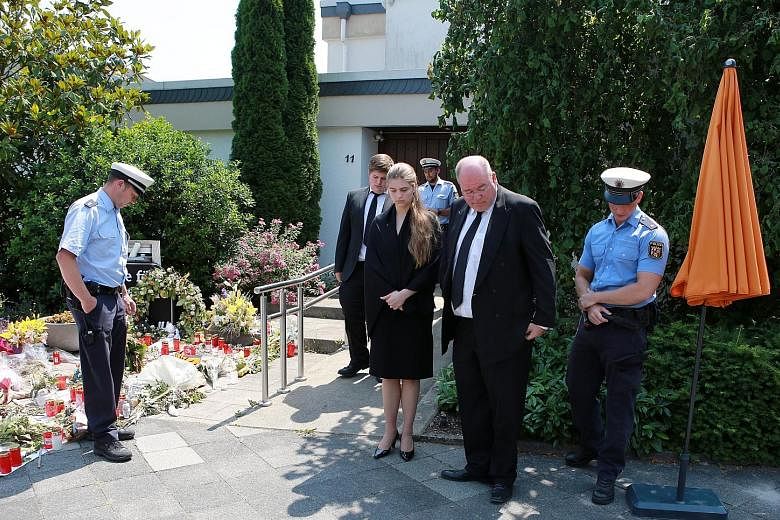 Above: Mr Helmut Kohl died on Friday at the age of 87. Left: Mr Walter Kohl, his son, and his niece were seen standing outside the late former German chancellor's home in Oggersheim, Ludwigshafen, on Wednesday after being turned away at the door in f
