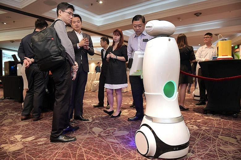 A retail robot interacting with guests at an event last month. According to a study by the McKinsey Global Institute released this year, the easiest jobs to automate are those involving predictable physical activities such as assembly line work in ma