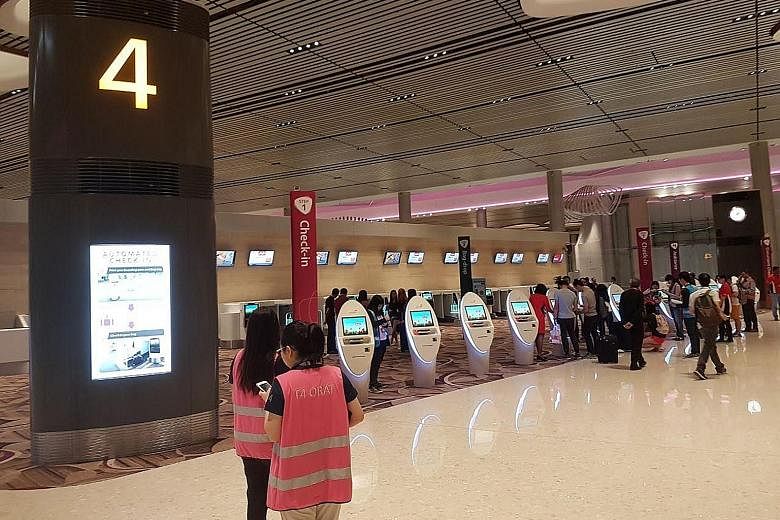 The new Terminal 4 offers a start-to-end automated system to reduce reliance on manpower, though it also features manual counters. Last night, airport staff were on hand to assist passengers who were not familiar with the system.