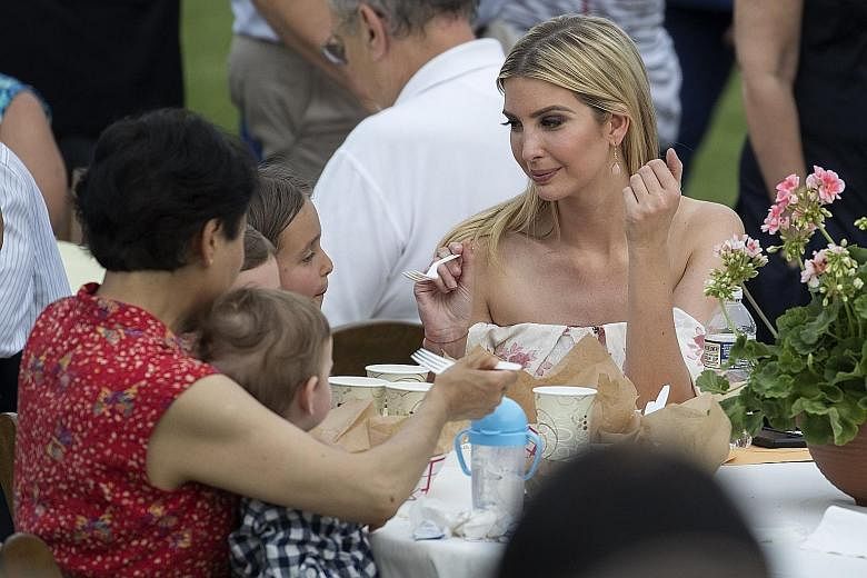 Ms Ivanka Trump with her children at a White House event last Thursday. Luxury brand Aquazzura has filed a lawsuit claiming that the Hettie footwear sold under her namesake apparel line "copied nearly every detail" of its popular Wild Thing Shoe.
