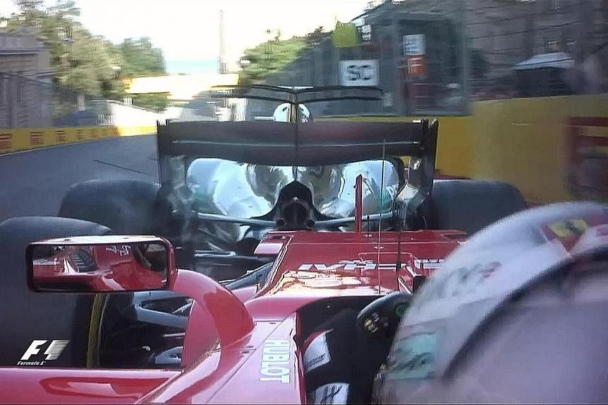 Ferrari’s Sebastian Vettel bumps into the back of Lewis Hamilton’s Mercedes while behind the safety car on Lap 20. Vettel suffers a damaged front wing and is angry, thinking that the leader had brake-tested him.