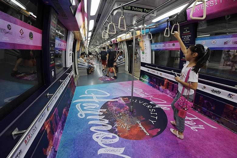 The Harmony Train, a collaboration between the Thye Hua Kwan Moral Society and the National Youth Council, has decals with messages promoting racial and religious harmony. It will run along the North-East Line throughout next month - which is both Ha