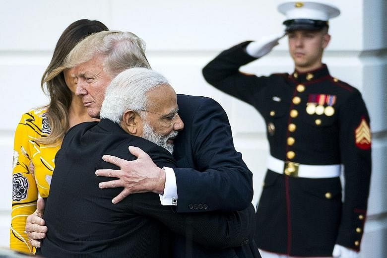 Indian Prime Minister Narendra Modi and US President Donald Trump exchanging a hug following their dinner at the White House on Monday. The Indian leader is known to hug leaders he gets on with.