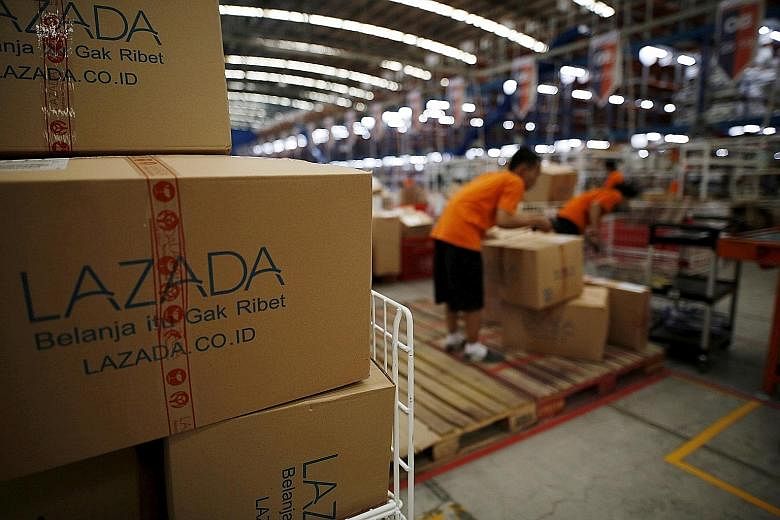 Lazada staff at a Jakarta warehouse. The firm covers six countries and runs about a dozen warehouses and several distribution centres.