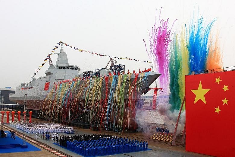 China's new 10,000-ton warship being launched at Jiangnan Shipyard in Shanghai yesterday. Said to be the first Type 055 destroyer, it is equipped with new air defence, anti-missile, anti-ship and anti-submarine weapons.
