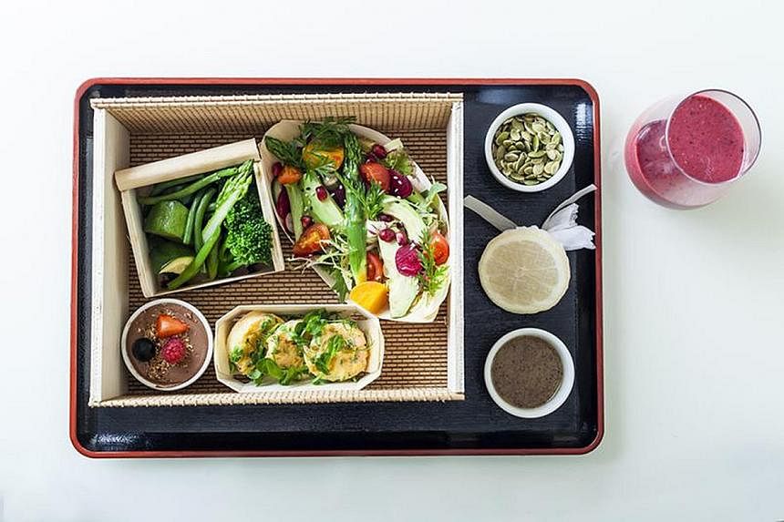 Anantara Siam's room service includes Nam Prig Long Rua (above), a chilli-spiked stir-fry dish, and The Dorchester serves healthy bentos (left). Breakfast is available almost around the clock at Four Seasons Hotel New York Downtown.