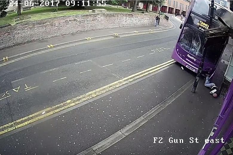 A screen grab from video footage showing Mr Simon Smith struck by an out-of-control bus in the British town of Reading last Saturday.