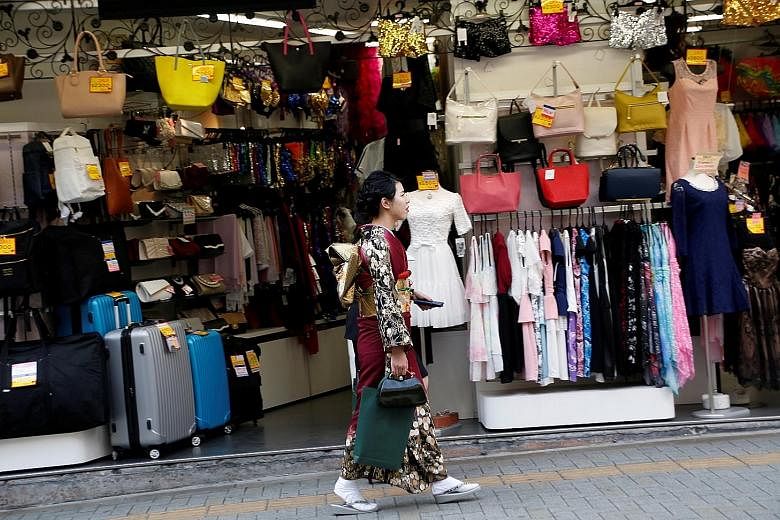 Sales in Japan fell 1.6 per cent last month from April. With wages stagnant or falling for years, growth in spending has been weak, and without a rebound in pay, it is unlikely that consumers will start spending a lot more.