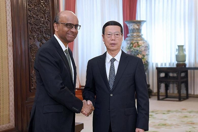 Deputy Prime Minister Tharman Shanmugaratnam meeting Chinese Vice-Premier Zhang Gaoli yesterday. During Mr Tharman's five-day trip to China, he met national and local leaders, including Premier Li Keqiang.