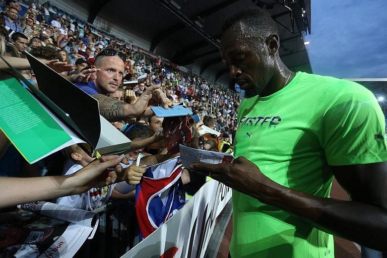 Track superstar Usain Bolt signing autographs for fans in Ostrava, Czech Republic. He has one more scheduled event before his swansong at the world championships.