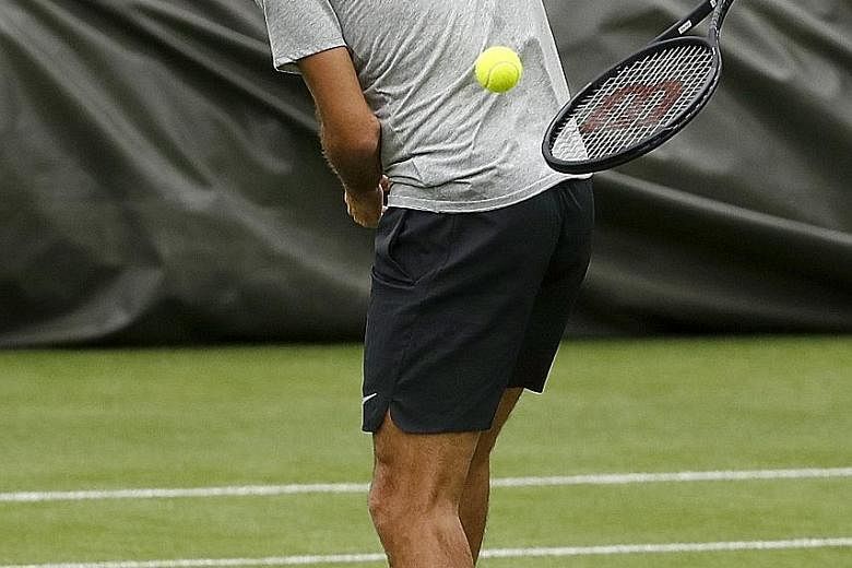 Swiss legend Roger Federer training at the All England Lawn Tennis Club yesterday. The seven-time Wimbledon champion is the bookies' favourite despite being seeded third and will start off against Ukraine's Alexandr Dolgopolov.
