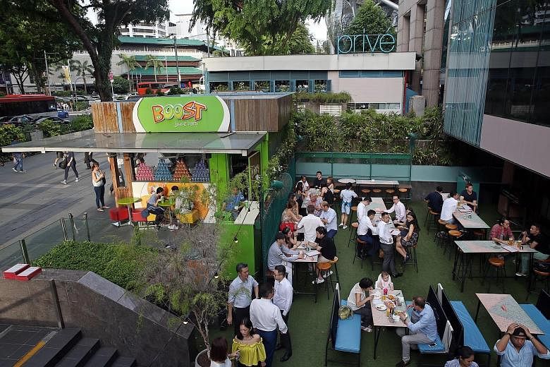 Left: Smoking areas at outdoor seating areas in eateries in Orchard Road will be a thing of the past come June 30 next year. Right: A smoking corner at a Toa Payoh coffee shop. New applications for smoking corners at food establishments will not be a