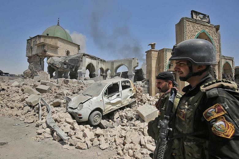 Members of the Iraqi Counter-Terrorism Service at the destroyed Al-Nuri Mosque in the Old City of Mosul. They are continuing their offensive to retake the city from ISIS militants. The terror group blew up the mosque and the famed Al-Hadba leaning mi