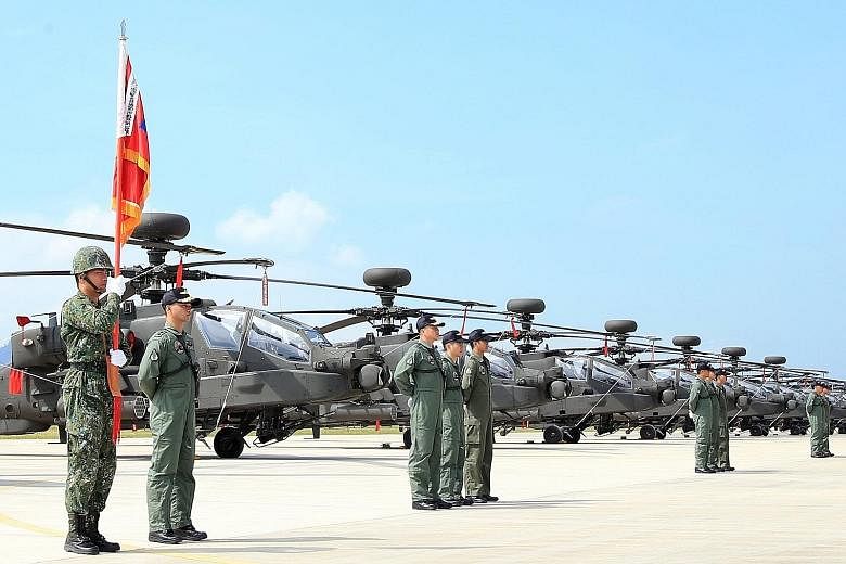 Apache attack helicopters being displayed in a ceremony at a military base in Taoyuan County, northern Taiwan, on Wednesday. The latest arms sales, announced on Thursday, comes just one day after a proposal by a US Senate panel to allow American wars