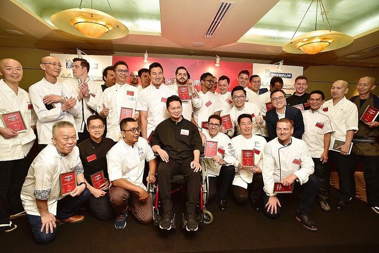 Chefs and representatives of restaurants that received Michelin stars during the launch of the second edition of Michelin Guide Singapore last Thursday.