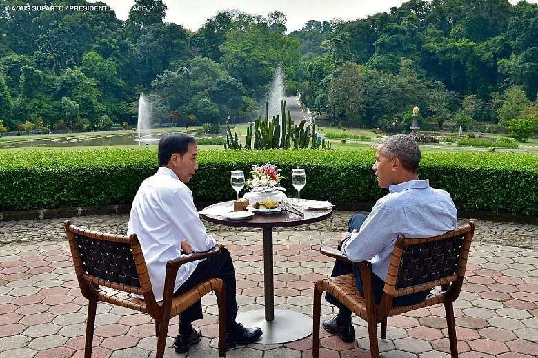 Indonesian President Joko Widodo and former US president Barack Obama at the presidential palace in Bogor last Friday. Mr Obama, who spent four years in Indonesia as a child, returned for a holiday last week.