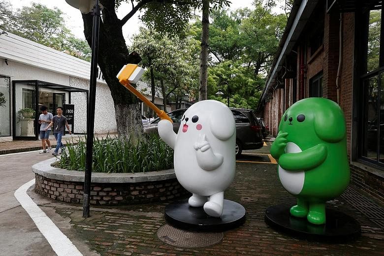 WeChat mascots on display near Tencent's office in Guangzhou. The Internet giant listed in Hong Kong, but other hot New Economy firms seem to be looking outside the region for their IPOs, which has Asian exchanges scrambling to find ways to woo their