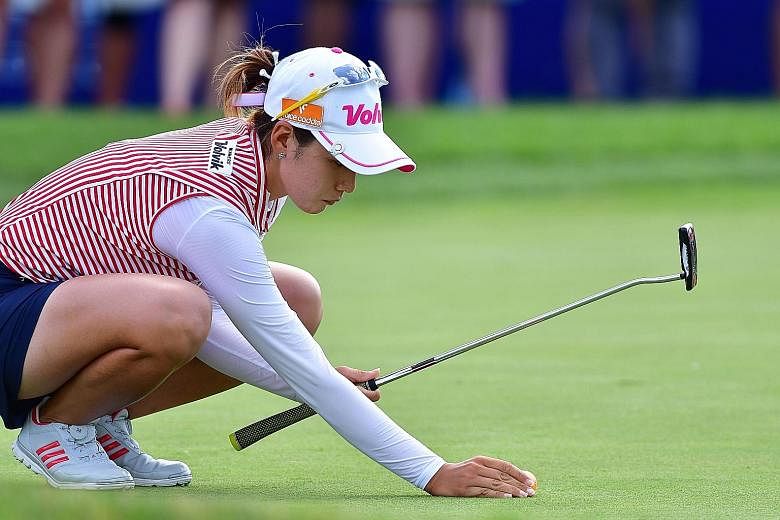 Chella Choi lining up her putt during the third round of Women's PGA Championship. The South Korean joint leader will be looking to secure her first Major triumph, with her only LPGA title coming in 2015 at the Marathon Classic.