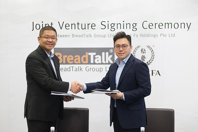 BreadTalk chief executive Henry Chu (left) and Mr Yeo Hart Pong, managing director of Song Fa Holdings, at the signing of the joint venture agreement.