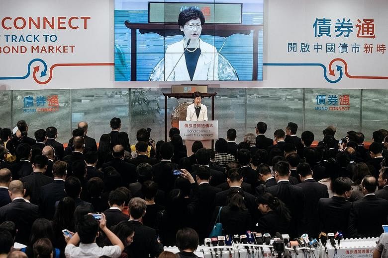 Chief Executive Carrie Lam at the launch of the China-Hong Kong Bond Connect at the Hong Kong stock exchange yesterday. The two offerings launched were intended to coincide with the 20th anniversary of Britain's handover of Hong Kong to China on July
