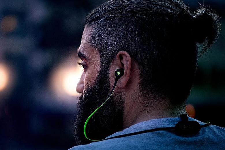 The Razer Hammerhead BT's pod has a magnetic clip for securing on the back of your shirt.